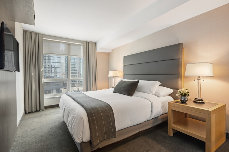 Crisp white hotel bed linens professionally laundered